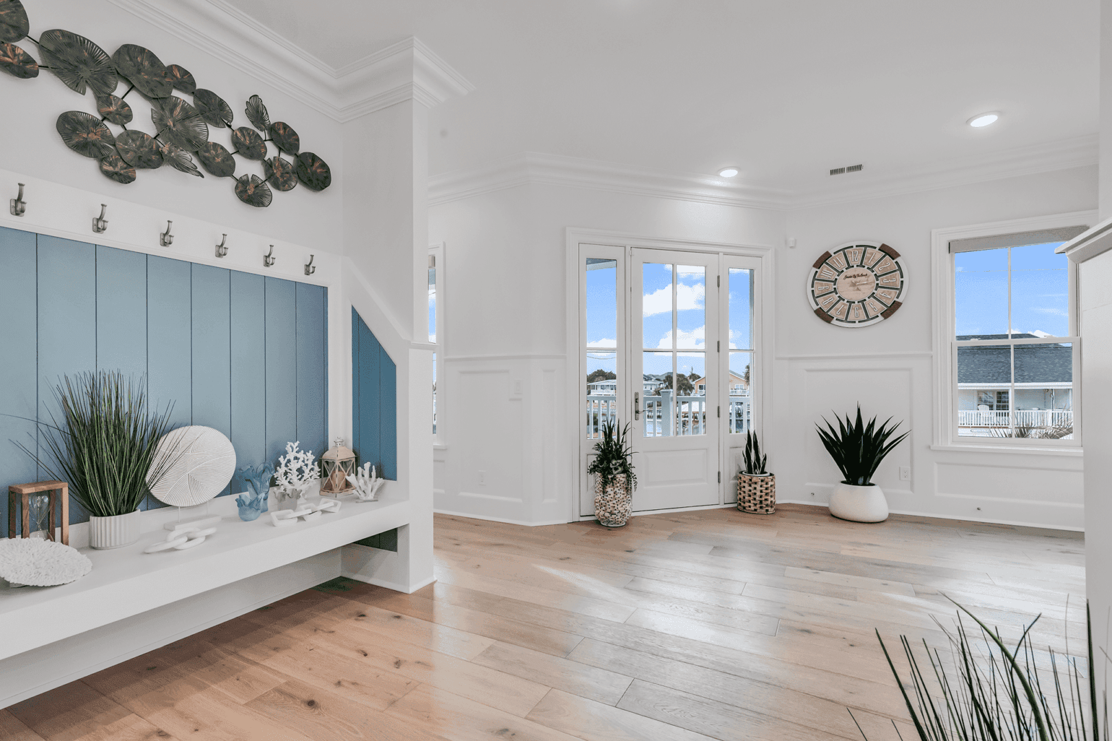 Bright, spacious living room with wooden floors and modern decor.